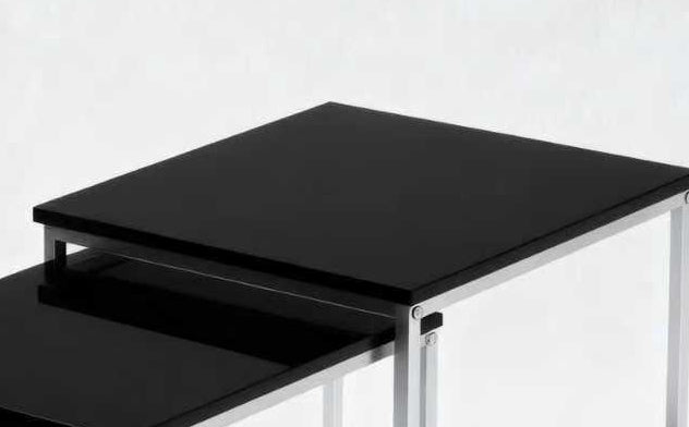 This modern nesting coffee table set features a sleek black high-gloss finish and a durable metal frame. Its space-saving, detachable design is versatile for any living room, office, or compact space.