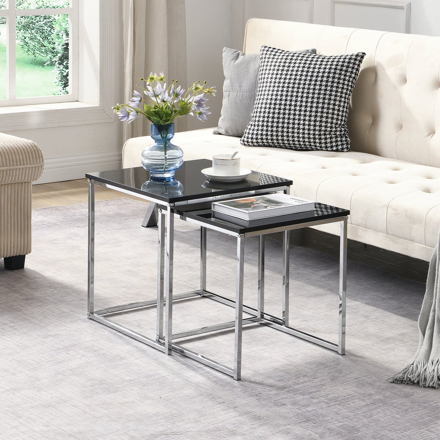 This modern nesting coffee table set features a sleek blake high-gloss finish and a durable metal frame. Its space-saving, detachable design is versatile for any living room, office, or compact space.