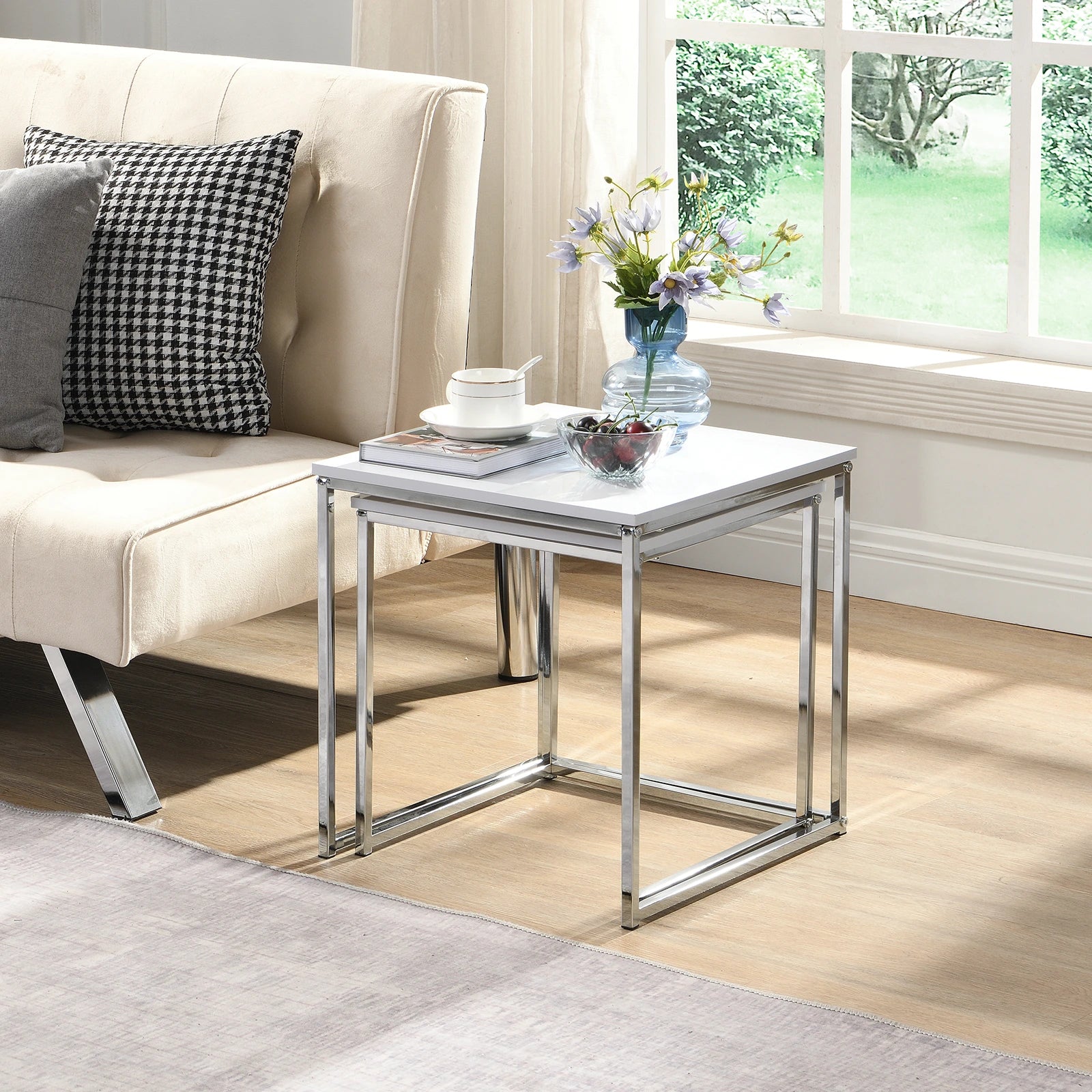 This modern nesting coffee table set features a sleek white high-gloss finish and a durable metal frame. Its space-saving, detachable design is versatile for any living room, office, or compact space.