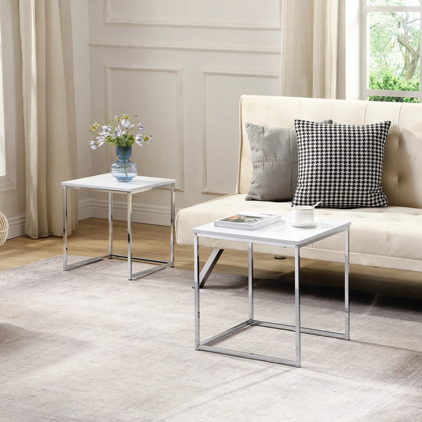 This modern nesting coffee table set features a sleek white high-gloss finish and a durable metal frame. Its space-saving, detachable design is versatile for any living room, office, or compact space.
