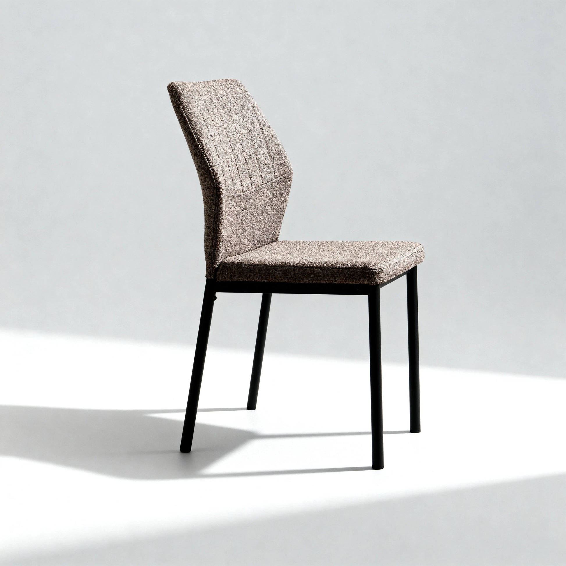 Ergonomic desk chair with contoured backrest and stable metal legs.
Durable dining chair with 150kg weight capacity and rust-resistant frame.