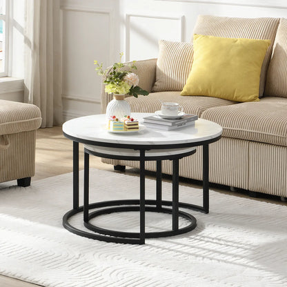 Modern round nesting coffee tables with white marble-look tops and black metal frames, offering flexible layered or separate use for small living spaces.