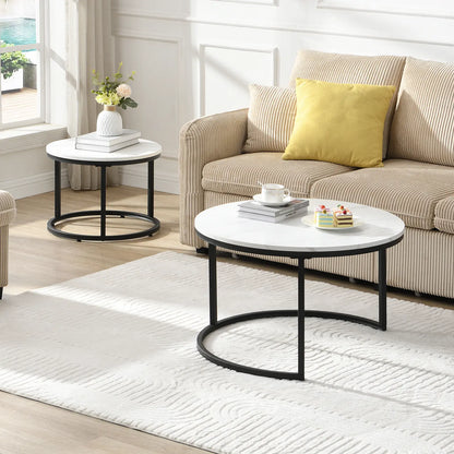 Modern round nesting coffee tables with white marble-look tops and black metal frames, offering flexible layered or separate use for small living spaces.